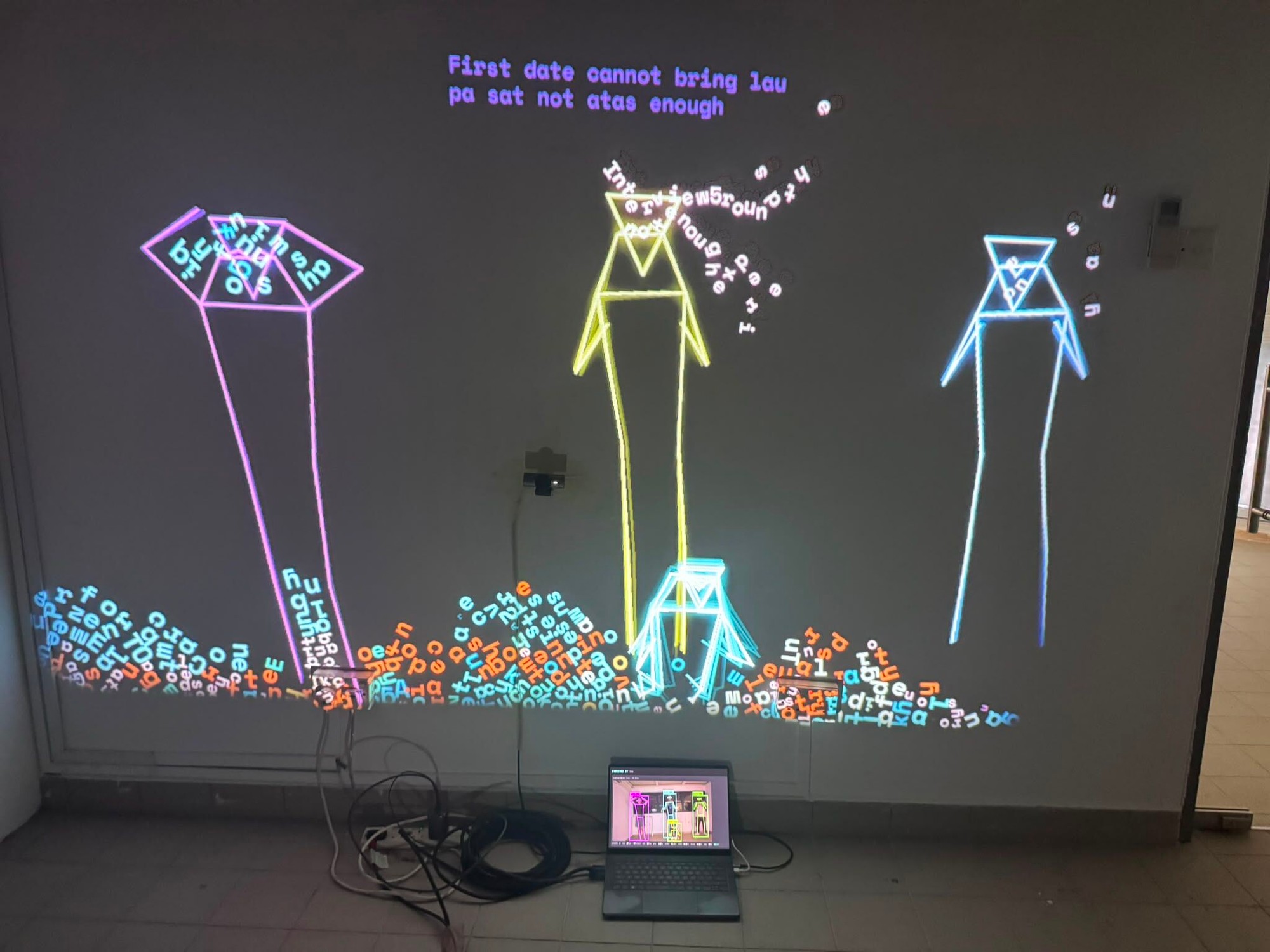 three neon avatars on the wall with complaints falling into a heap of letters