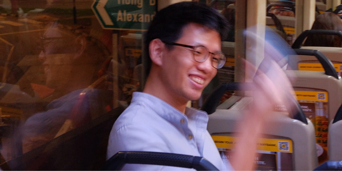laughing while shaking the phone on a bus
